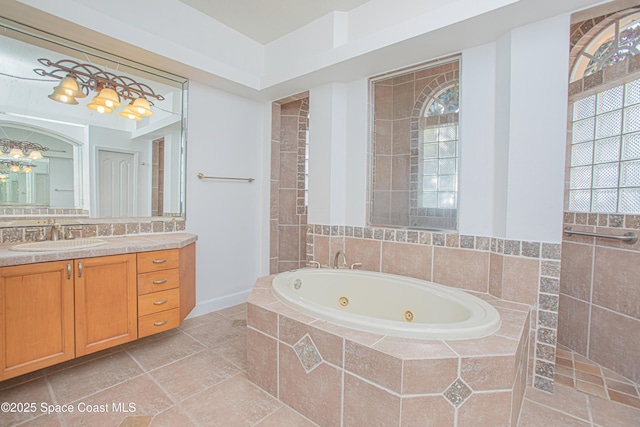 4180 Stoney Point Rd, Melbourne, FL 32940 - full bathroom with a jetted tub, vanity, and a chandelier