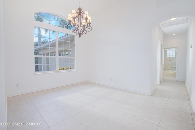 4180 Stoney Point Rd, Melbourne, FL 32940 - unfurnished room with light tile patterned floors, a chandelier, and arched walkways