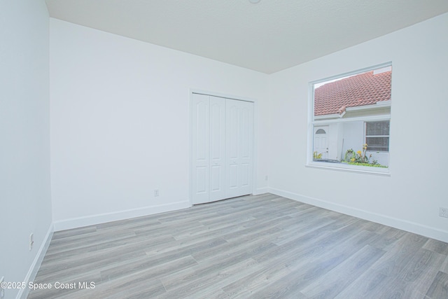 4180 Stoney Point Rd, Melbourne, FL 32940 - empty room with wood finished floors and baseboards