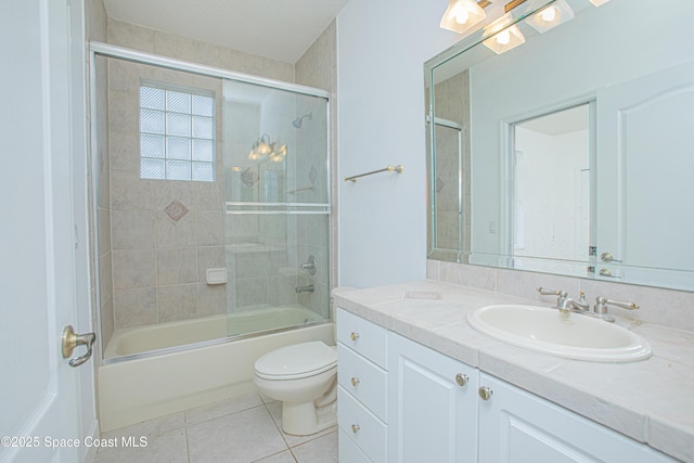 4180 Stoney Point Rd, Melbourne, FL 32940 - full bath with vanity, tile patterned floors, and enclosed tub / shower combo