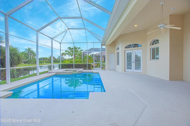 4180 Stoney Point Rd, Melbourne, FL 32940 - view of pool with french doors, a water view, a patio area, ceiling fan, and a pool with connected hot tub