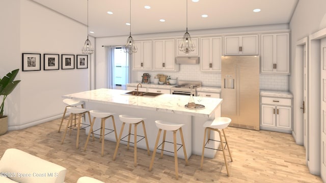 1850 Viburnum Rd NW, Palm Bay, FL 32907 - kitchen featuring high end refrigerator, range, a kitchen bar, under cabinet range hood, and light wood-type flooring