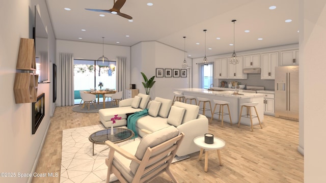 1850 Viburnum Rd NW, Palm Bay, FL 32907 - living room featuring light wood-style flooring, a ceiling fan, and recessed lighting