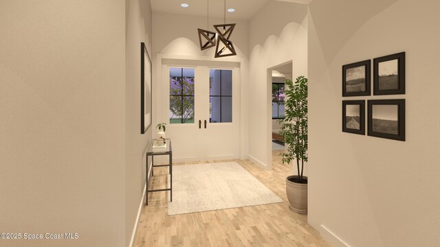 1850 Viburnum Rd NW, Palm Bay, FL 32907 - hall with wood finished floors, recessed lighting, and a towering ceiling