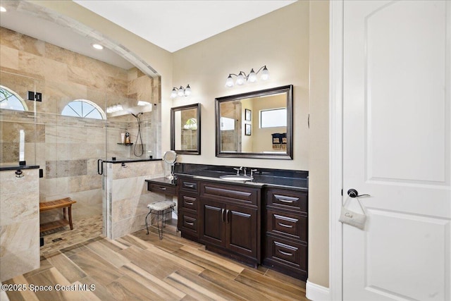 4464 Preservation Cir, Melbourne, FL 32934 - full bathroom with vanity, a stall shower, and wood finished floors