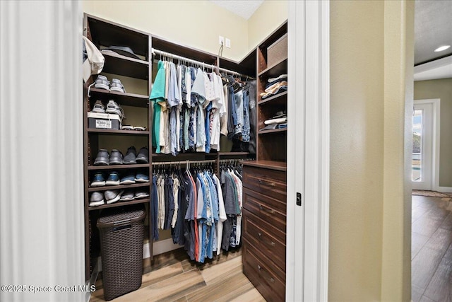 4464 Preservation Cir, Melbourne, FL 32934 - spacious closet featuring wood finished floors