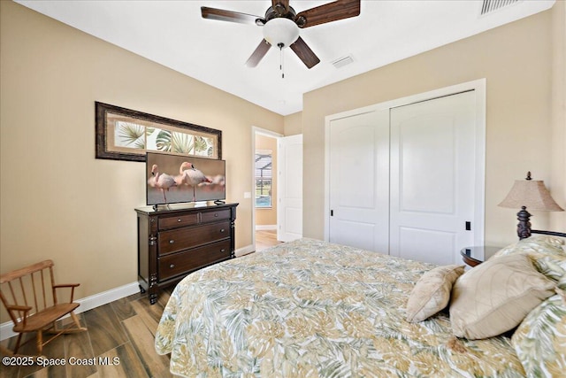 4464 Preservation Cir, Melbourne, FL 32934 - bedroom featuring wood finished floors, a closet, and a ceiling fan