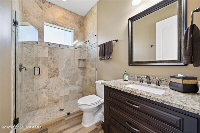 4464 Preservation Cir, Melbourne, FL 32934 - full bathroom featuring a shower stall, vanity, and wood finished floors