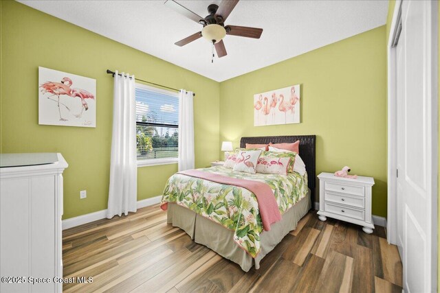 4464 Preservation Cir, Melbourne, FL 32934 - bedroom with wood finished floors and a ceiling fan