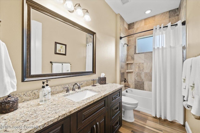 4464 Preservation Cir, Melbourne, FL 32934 - full bath featuring vanity, shower / bath combo with shower curtain, and wood finished floors