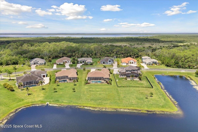 4464 Preservation Cir, Melbourne, FL 32934 - aerial view of residential area featuring a large body of water and a heavily wooded area