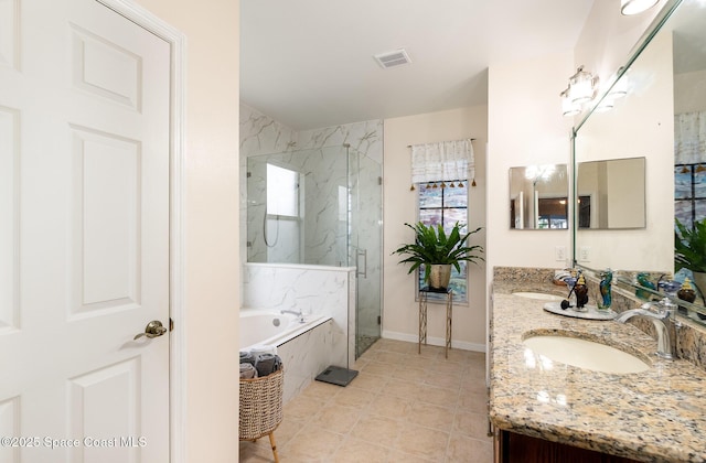 4185 Fenrose Cir, Melbourne, FL 32940 - full bathroom with a garden tub, double vanity, a marble finish shower, and tile patterned floors