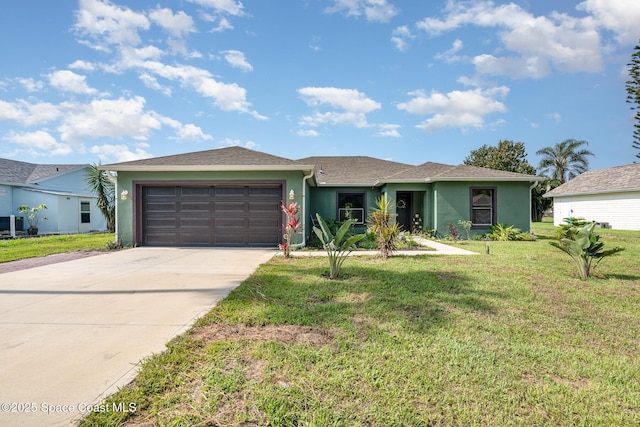 950 Douglas St SE, Palm Bay, FL 32909 - ranch-style house featuring stucco siding, a garage, concrete driveway, and a front lawn