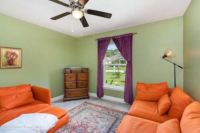 950 Douglas St SE, Palm Bay, FL 32909 - carpeted living area featuring baseboards and a ceiling fan