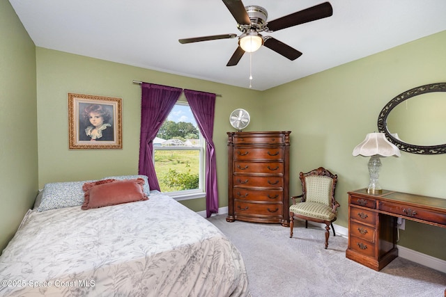 950 Douglas St SE, Palm Bay, FL 32909 - carpeted bedroom featuring baseboards and a ceiling fan