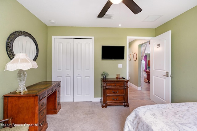 950 Douglas St SE, Palm Bay, FL 32909 - bedroom featuring a closet, light carpet, and a ceiling fan