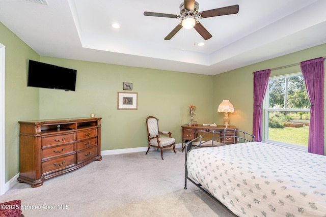 950 Douglas St SE, Palm Bay, FL 32909 - bedroom with light carpet, a raised ceiling, recessed lighting, and a ceiling fan