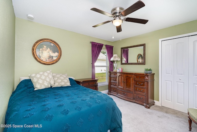 950 Douglas St SE, Palm Bay, FL 32909 - bedroom featuring a closet, light colored carpet, and ceiling fan