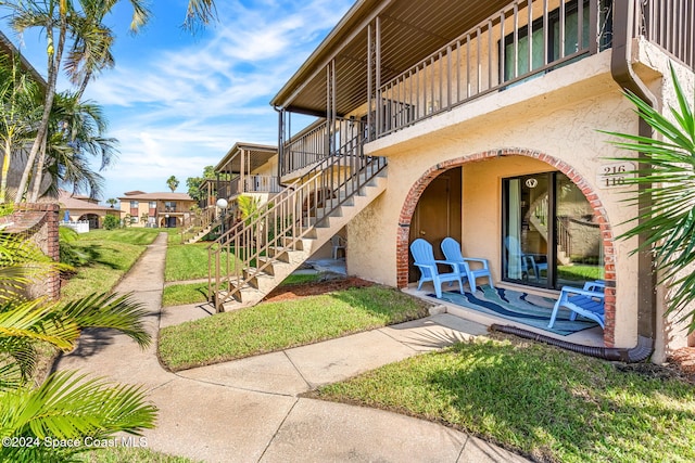 116 San Paulo Cir Unit 16-116, West Melbourne, FL 32904 - view of property's community featuring stairs and a lawn
