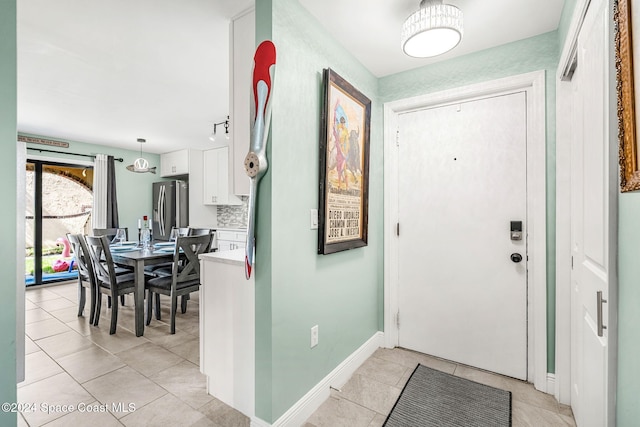 116 San Paulo Cir Unit 16-116, West Melbourne, FL 32904 - foyer featuring light tile patterned floors