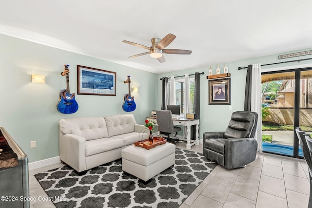 116 San Paulo Cir Unit 16-116, West Melbourne, FL 32904 - living room with a ceiling fan, tile patterned flooring, and a desk