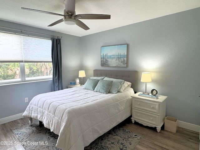 225 Buccaneer Ave Unit C2-207, Merritt Island, FL 32952 - bedroom with wood finished floors and ceiling fan