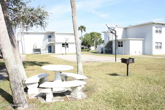 225 Buccaneer Ave Unit C2-207, Merritt Island, FL 32952 - view of green lawn featuring stairway