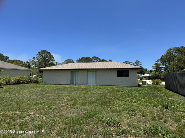 1112 Wabash Rd SE, Palm Bay, FL 32909 - back of property featuring stucco siding