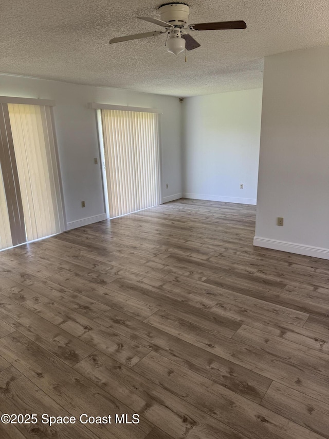 1112 Wabash Rd SE, Palm Bay, FL 32909 - spare room featuring wood finished floors, ceiling fan, and a textured ceiling