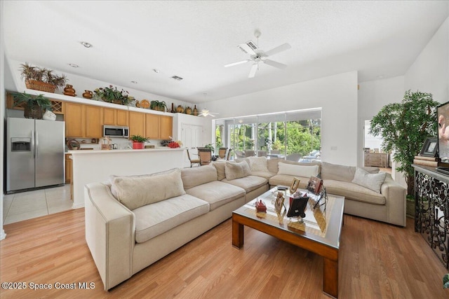 984 Wimbledon Dr, Melbourne, FL 32940 - living room with a ceiling fan and light wood finished floors