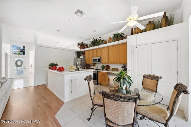 984 Wimbledon Dr, Melbourne, FL 32940 - dining area featuring a ceiling fan and light wood-type flooring
