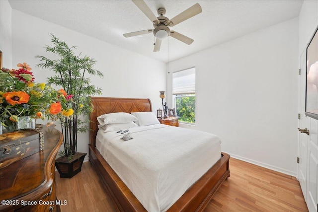 984 Wimbledon Dr, Melbourne, FL 32940 - bedroom with light wood-style flooring and baseboards