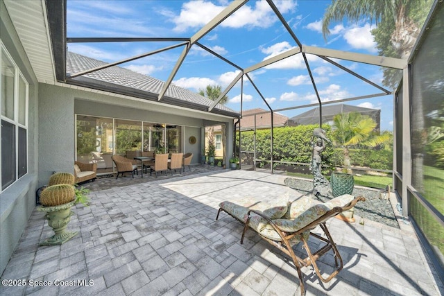 984 Wimbledon Dr, Melbourne, FL 32940 - view of patio with an outdoor living space, outdoor dining area, and a lanai