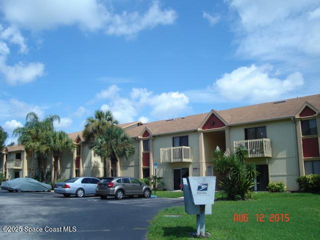 2101 Forest Knoll Dr NE Unit 01-206, Palm Bay, FL 32905 - view of property featuring uncovered parking and a residential view