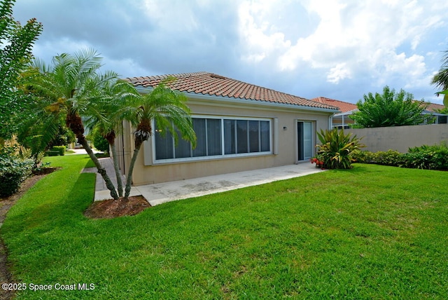 3531 Plume Way SE, Palm Bay, FL 32909 - back of property featuring a tile roof, stucco siding, and a patio area