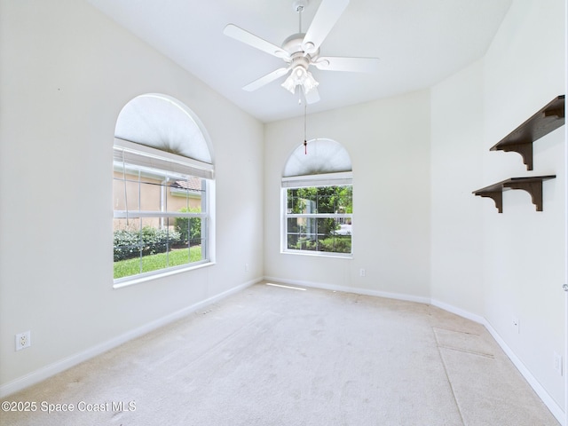 3531 Plume Way SE, Palm Bay, FL 32909 - carpeted empty room with plenty of natural light and a ceiling fan