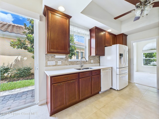 3531 Plume Way SE, Palm Bay, FL 32909 - kitchen with white appliances, light countertops, plenty of natural light, and tasteful backsplash