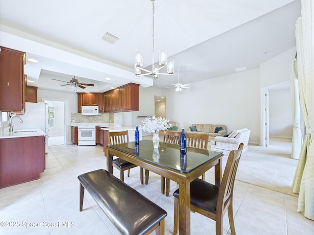 3531 Plume Way SE, Palm Bay, FL 32909 - dining area with ceiling fan, a chandelier, light tile patterned floors, and recessed lighting