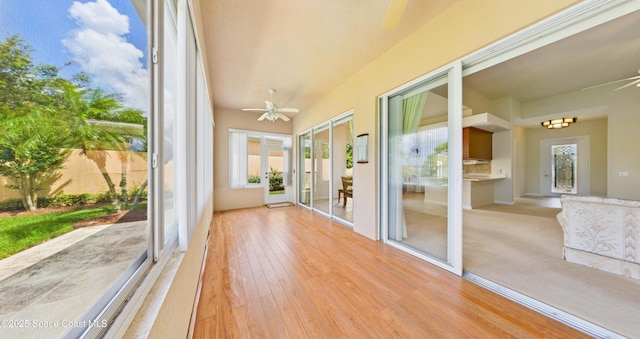 3531 Plume Way SE, Palm Bay, FL 32909 - unfurnished sunroom featuring wood finished floors
