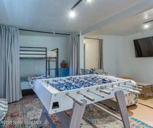 936 Santa Cruz Rd, Cocoa Beach, FL 32931 - bedroom with a textured ceiling and concrete block wall