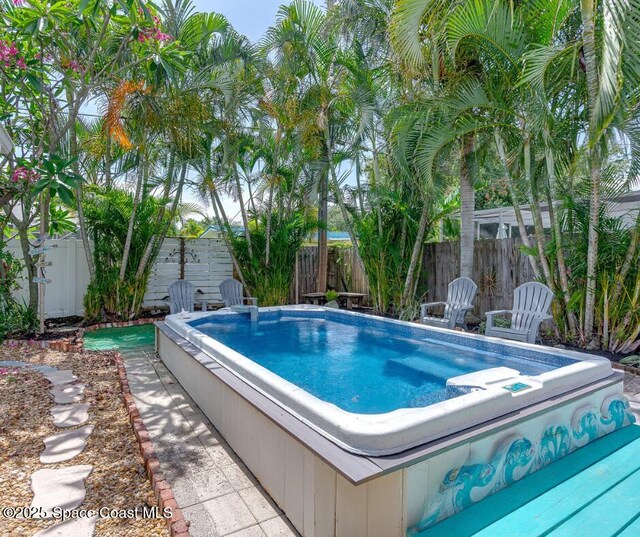 936 Santa Cruz Rd, Cocoa Beach, FL 32931 - view of pool with a jacuzzi and a fenced backyard