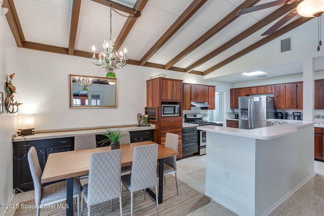 936 Santa Cruz Rd, Cocoa Beach, FL 32931 - kitchen with stainless steel appliances, light countertops, under cabinet range hood, a chandelier, and beamed ceiling