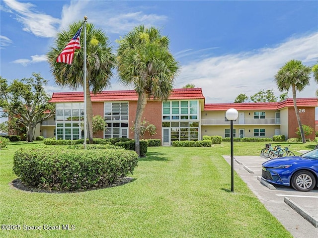 26 Pine Arbor Ln Unit 205, Vero Beach, FL 32962 - view of property with uncovered parking