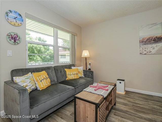 26 Pine Arbor Ln Unit 205, Vero Beach, FL 32962 - living room featuring wood finished floors and a textured ceiling