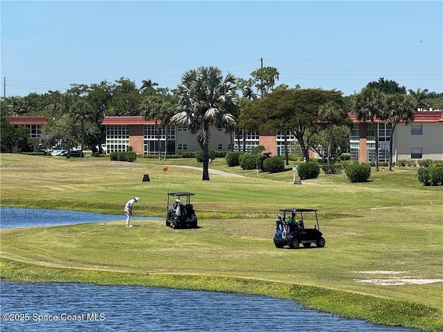 26 Pine Arbor Ln Unit 205, Vero Beach, FL 32962 - view of property's community featuring a lawn and a water view