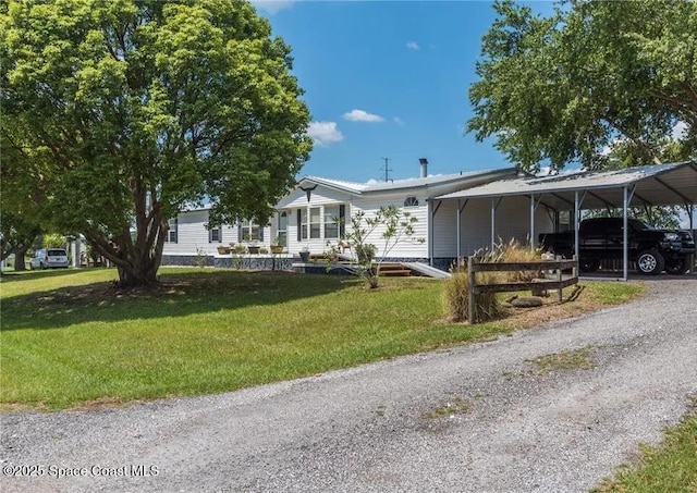 1317 Ashlee Ct, Auburndale, FL 33823 - view of front facade featuring a front yard and a carport