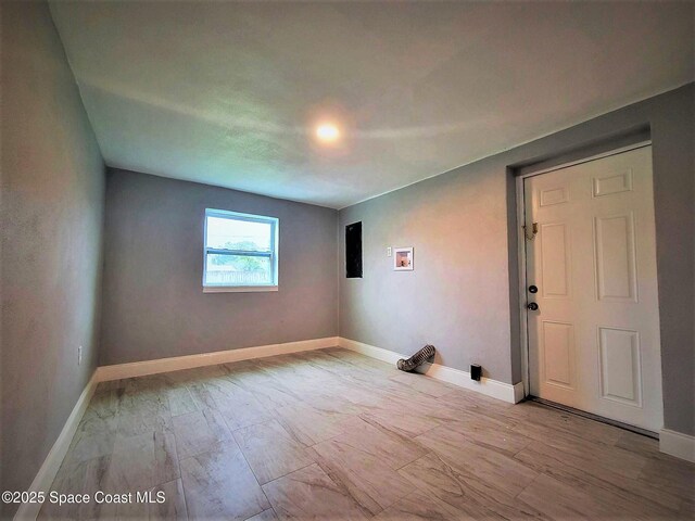 2309 Dairy Rd, Melbourne, FL 32904 - spare room featuring wood finished floors and electric panel