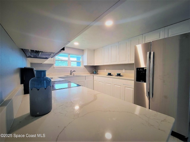 2309 Dairy Rd, Melbourne, FL 32904 - kitchen featuring stainless steel refrigerator with ice dispenser, white cabinets, light stone countertops, stove, and recessed lighting