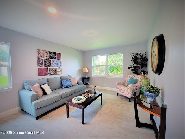 2309 Dairy Rd, Melbourne, FL 32904 - living room featuring baseboards