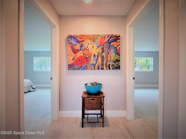 2309 Dairy Rd, Melbourne, FL 32904 - hall featuring healthy amount of natural light and wood finished floors